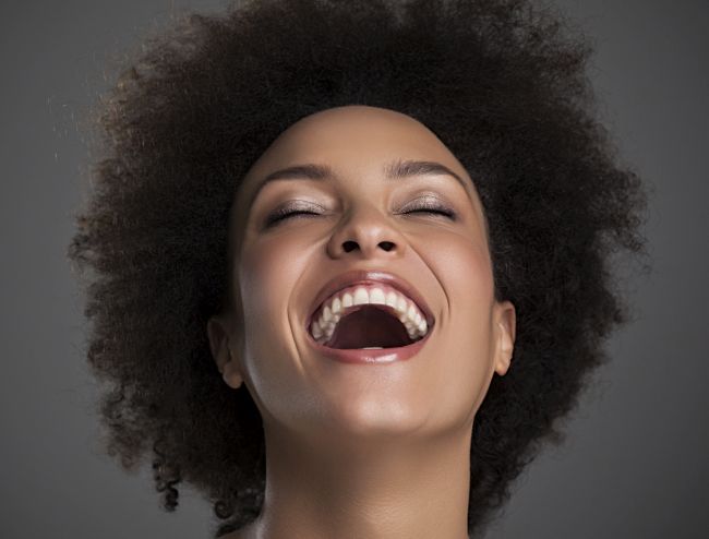 Portrait of a beautiful African woman laughing.